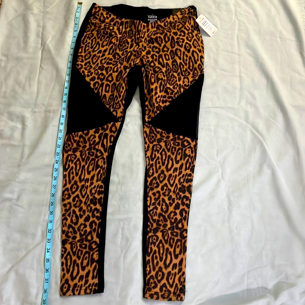 Animal print leggings with mesh insert.